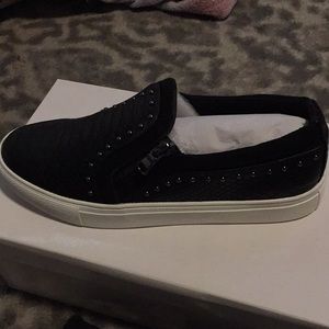 Report black slip on sneakers